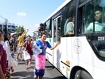 Released prisoners, in a bus, are welcomed by family members and colleagues after they left Insein Prison on Sunday. 