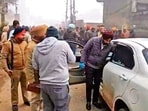 Police officials at the crime spot in Bhinder Kalan village of Moga district on Saturday. (Sanjeev Kumar /HT)