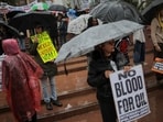A protestor holds 'no blood for oil" placard during an anti-war rally in Los Angeles, California, U.S., January 3, 2026.&nbsp;