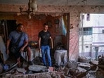 Jesus Linares and his work partner Reggie Carrera stand at his damaged apartment, after the US strike on Venezuela, capturing its President Nicolas Maduro and his wife Cilia Flores, in Catia La Mar, Venezuela, on January 4.