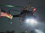 One of the helicopters carrying Venezuela's President Nicolas Maduro and his wife Cilia Flores arrives after they were captured overnight in Venezuela by US forces on Saturday