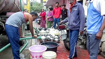 People fill buckets with water from a water tanker as more than 200 people are hospitalised due to water contamination in Indore. (ANI Video Grab) (ANI Video Grab) People fill buckets with water from a water tanker as more than 200 people are hospitalised due to water contamination in Indore. (ANI Video Grab) (ANI Video Grab)