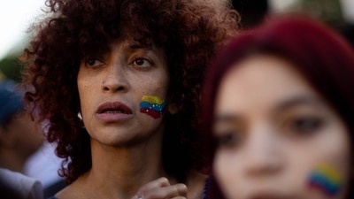 A woman with her face painted with the Venezuelan flag gestures as she celebrates at the Obelisk in Buenos Aires on January 3, 2026, after US forces captured Venezuelan leader Nicolas Maduro. (Photo by TOMAS CUESTA / AFP) (AFP) A woman with her face painted with the Venezuelan flag gestures as she celebrates at the Obelisk in Buenos Aires on January 3, 2026, after US forces captured Venezuelan leader Nicolas Maduro. (Photo by TOMAS CUESTA / AFP) (AFP)