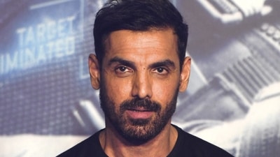 John Abraham poses for pictures. (AFP) John Abraham poses for pictures. (AFP)