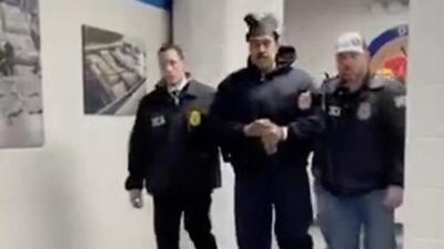 Nicolas Maduro is perp walked by DEA agents inside the headquarters of the US Drug Enforcement Administration (DEA) in lower Manhattan, New York, on January 3. (AFP) Nicolas Maduro is perp walked by DEA agents inside the headquarters of the US Drug Enforcement Administration (DEA) in lower Manhattan, New York, on January 3. (AFP)