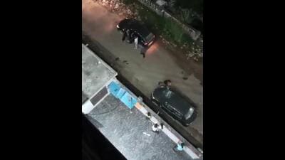 The 36-second video purportedly shows a man carrying a rod breaking the windshield of a parked car outside the girls’ PG while verbally abusing the PG owner. (Video grab/HT Photo) The 36-second video purportedly shows a man carrying a rod breaking the windshield of a parked car outside the girls’ PG while verbally abusing the PG owner. (Video grab/HT Photo)