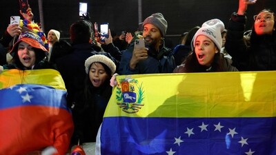 People hold the Venezuelan flag as they celebrate outside the Metropolitan Detention facility in the Brooklyn borough of New York, where ousted president Nicolas Maduro is expected to be held, on January 3, 2026 in New York City. (Photo by John Lamparski / AFP) (AFP) People hold the Venezuelan flag as they celebrate outside the Metropolitan Detention facility in the Brooklyn borough of New York, where ousted president Nicolas Maduro is expected to be held, on January 3, 2026 in New York City. (Photo by John Lamparski / AFP) (AFP)