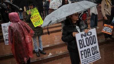 A protestor holds 'no blood for oil" placard during an anti-war rally in Los Angeles, California, U.S., January 3, 2026.&nbsp; (REUTERS)
