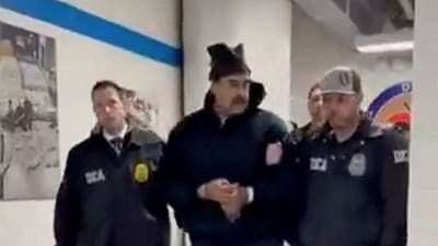 Image from video posted by the White House's Rapid Response 47 account on X showing Venezuela's President Nicolas Maduro being walked in custody down a hallway at the offices of the U.S. Drug Enforcement Administration (DEA) in New York City. (via REUTERS)