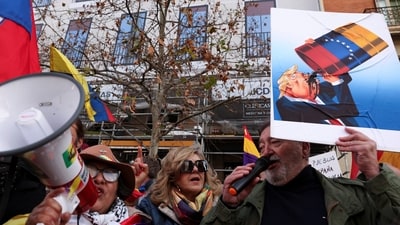 Demonstrators shout slogans as they protest outside the U.S. Embassy in Madrid against the U.S. strike on Venezuela (REUTERS)