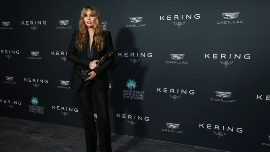 Miley Cyrus poses with the Outstanding Artistic Achievement Award for her song “Dream As One” from Avarar: Fire and Ash. REUTERS/Mario Anzuoni(REUTERS)