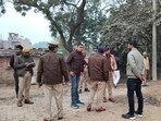 Police and a forensic team at the spot of the incident in Lokpur village in Mauaima area of Prayagraj. (HT Photo) Police and a forensic team at the spot of the incident in Lokpur village in Mauaima area of Prayagraj. (HT Photo)