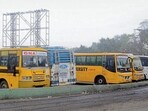 Private buses of educational institutions parked at ISBT in Ludhiana on Sunday. (Gurpreet Singh/HT)