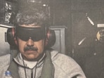 Nicolas Maduro (L) was seen wearing a Nike Tech jacket and trackpants set at the time of his capture. 