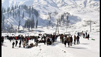 A view of tourists enjoying at a snow-covered ski resort in Gulmarg on Monday. (ANI) A view of tourists enjoying at a snow-covered ski resort in Gulmarg on Monday. (ANI)