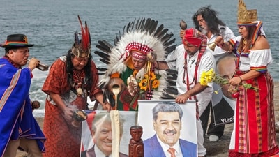 A group of shamans and healers from the coastal, Andean and Amazonian regions of Peru hold images of US President Donald Trump and ousted Venezuelan President Nicolas Maduro. (AFP) A group of shamans and healers from the coastal, Andean and Amazonian regions of Peru hold images of US President Donald Trump and ousted Venezuelan President Nicolas Maduro. (AFP)