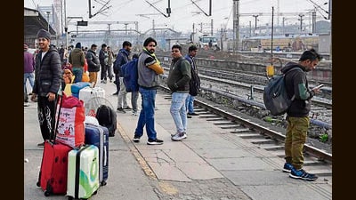 Passengers at the railway station in Ludhiana on Monday. (Gurpreet Singh/HT)