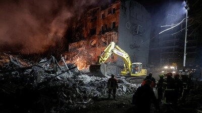Rescuers work at the site of an apartment building hit by a Russian air strike, amid Russia's attack on Ukraine, in Kharkiv, Ukraine. (REUTERS)
