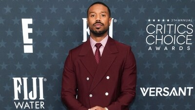 Sinners star Michael B Jordan made a statement in a beautifully fit double-breasted suit in burgundy by Louis Vuitton. He styled the ensemble with a tonally matched shirt, a striped tie, and boots by Christian Louboutin.&nbsp; (Getty Images via AFP)