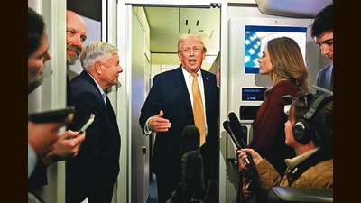 US President Donald Trump, accompanied by Senator Lindsey Graham, speaks with reporters aboard Air Force One. (AFP) US President Donald Trump, accompanied by Senator Lindsey Graham, speaks with reporters aboard Air Force One. (AFP)