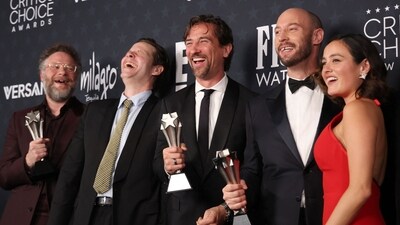 (L-R) Canadian director/actor Seth Rogen, US actor Ike Barinholtz, executive producer James Weaver, Canadian director Evan Goldberg and US actress Chase Sui Wonders of the TV series "The Studio" pose in the press room after winning the Best Comedy Series award during the 31st Annual Critics Choice Awards at Barker Hangar in Santa Monica, California, on January 4, 2026. (Photo by Michael Tran / AFP) (AFP)