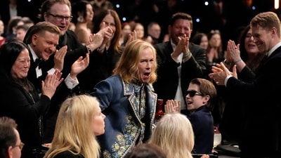 Amy Madigan, center, reacts to winning the award for best supporting actress for "Weapons" during the 31st Annual Critics Choice Awards on Sunday, Jan. 4, 2026, at The Barker Hanger in Santa Monica, Calif. (AP Photo/Chris Pizzello) (Chris Pizzello/Invision/AP)