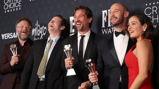 (L-R) Canadian director/actor Seth Rogen, US actor Ike Barinholtz, executive producer James Weaver, Canadian director Evan Goldberg and US actress Chase Sui Wonders of the TV series "The Studio" pose in the press room after winning the Best Comedy Series award during the 31st Annual Critics Choice Awards at Barker Hangar in Santa Monica, California, on January 4, 2026. (Photo by Michael Tran / AFP)(AFP)
