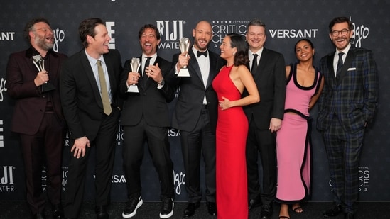 Seth Rogen, from left, winner of the award for best actor in a comedy series for "The Studio," Ike Barinholtz, winner of the award for best supporting actor in a comedy series for "The Studio," James Weaver, Evan Goldberg, Chase Sui Wonders, Alex Gregory, Frida Perez and Peter Huyck, pose with the award for best comedy series for "The Studio" in the press room during the 31st Annual Critics Choice Awards on Sunday, Jan. 4, 2026, at The Barker Hanger in Santa Monica, Calif. (Photo by Jordan Strauss/Invision/AP)(Jordan Strauss/Invision/AP)