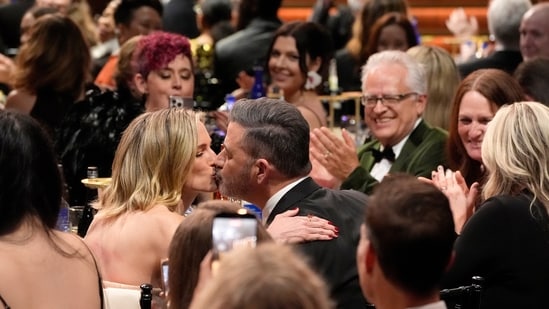 Jimmy Kimmel, right, kisses his wife, Molly McNearney, in the audience during the 31st Annual Critics Choice Awards on Sunday, Jan. 4, 2026, at The Barker Hanger in Santa Monica, Calif. (AP Photo/Chris Pizzello)(Chris Pizzello/Invision/AP)