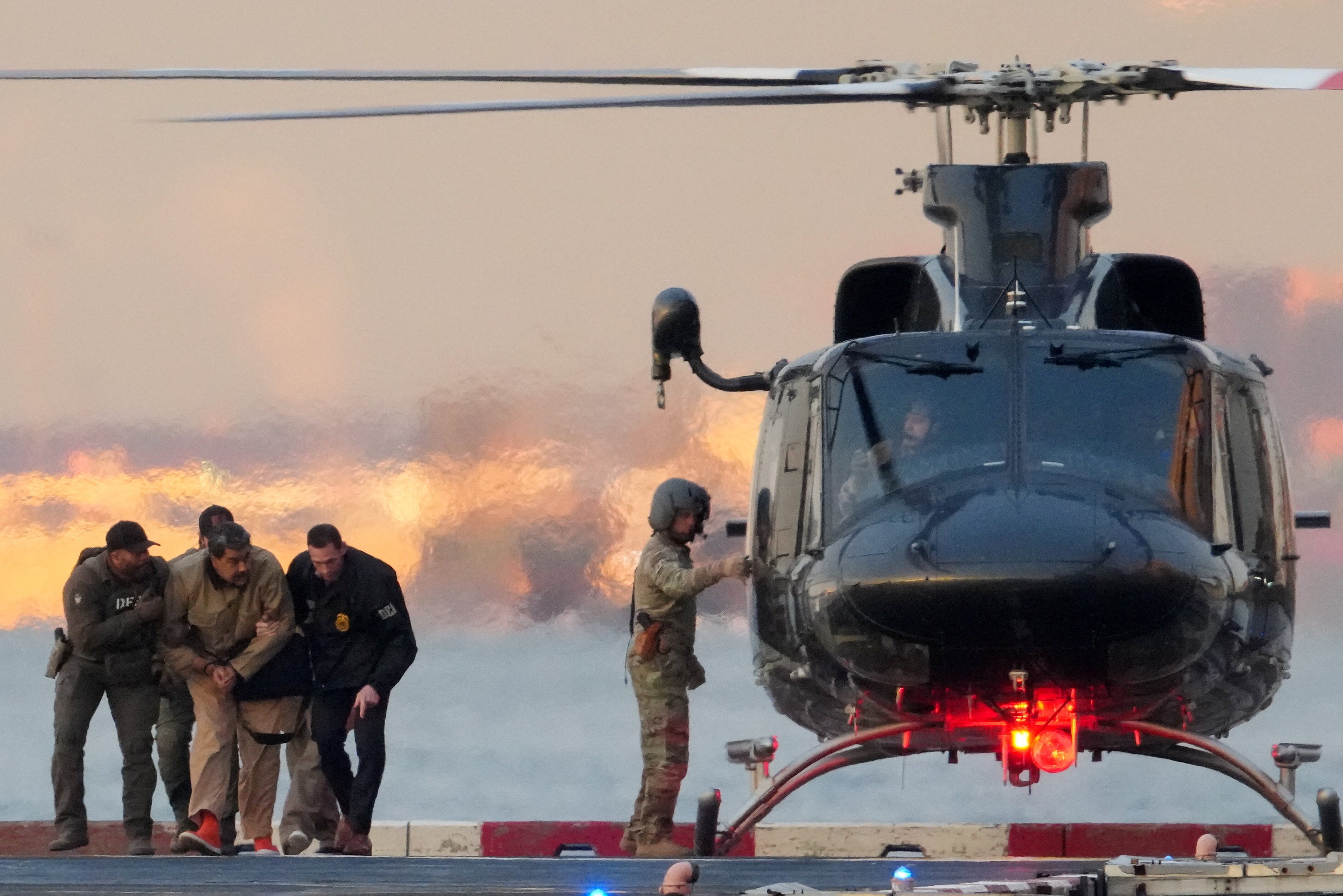 DEA (Drug Enforcement Administration) agents move captured Venezuelan President Nicolas Maduro from a helicopter, as Maduro heads towards the Daniel Patrick Manhattan United States Courthouse for an initial appearance to face U.S. federal charges. (REUTERS)