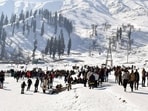 A view of tourists enjoying at a snow-covered ski resort in Gulmarg on Monday. (ANI)