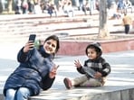 A woman and a child are all smiles at Sector 17 in Chandigarh on a sunny Monday afternoon. (Keshav Singh/HT)