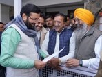 Haryana chief minister Nayab Singh Saini redressing the grievances of people at his residence in Chandigarh on Monday. (HT Photo)