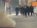 Iranian security forces using tear gas to disperse demonstrators in the Tehran bazaar. 