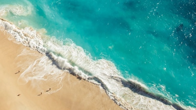 A sunlit Bali beach with crystal waters, perfect for relaxation, adventure, and affordable escapes. (Ai generated) A sunlit Bali beach with crystal waters, perfect for relaxation, adventure, and affordable escapes. (Ai generated)