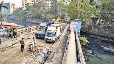 Mumbai, India - Jan. 9, 2025: The BMC closed the bridge over Mogra Nullah on Shastri Nagar Road, just before Bhaktivedanta School, last night, as part of its demolition plan scheduled for this week in Mumbai, India, on Thursday, January 9, 2025. (Photo by Satish Bate/ Hindustan Times) (Hindustan Times) Mumbai, India - Jan. 9, 2025: The BMC closed the bridge over Mogra Nullah on Shastri Nagar Road, just before Bhaktivedanta School, last night, as part of its demolition plan scheduled for this week in Mumbai, India, on Thursday, January 9, 2025. (Photo by Satish Bate/ Hindustan Times) (Hindustan Times)