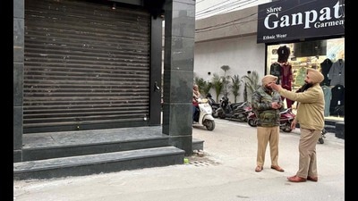 Neighbours told the police that they saw a group of masked men gathering outside the house, pelting stones and firing before fleeing from the spot. (HT Photo) Neighbours told the police that they saw a group of masked men gathering outside the house, pelting stones and firing before fleeing from the spot. (HT Photo)