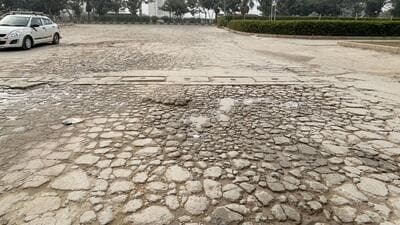 The damaged stretch of Sector 69 main road as seen on Tuesday. (Parveen Kumar/HT) The damaged stretch of Sector 69 main road as seen on Tuesday. (Parveen Kumar/HT)