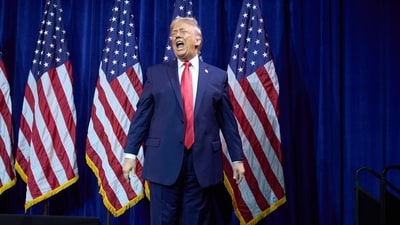 President Donald Trump walks off stage after speaking to House Republican lawmakers during their annual policy retreat. (AP) President Donald Trump walks off stage after speaking to House Republican lawmakers during their annual policy retreat. (AP)