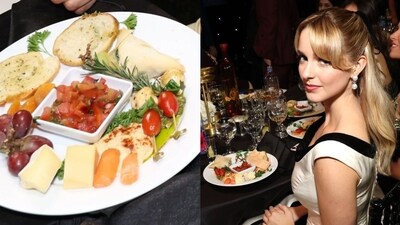 The snack plate featuring cheese, hummus, grapes, etc., and actor McKenna Grace at the show.