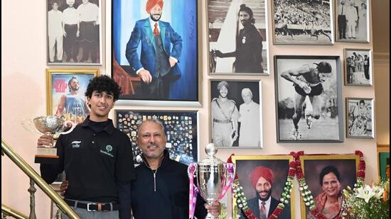 India’s veteran golfer Jeev Milkha Singh along with his son Harjai Milkha Singh at their residence. (Keshav Singh/Hindustan Times)