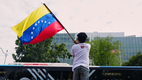 Venezuela News LIVE: A protester waves the Venezuelan flag during a rally outside the U.S. Embassy in Jakarta, Indonesia denouncing the U.S. capture of Venezuelan President Nicolas Maduro, Tuesday, Venezuela News LIVE: A protester waves the Venezuelan flag during a rally outside the U.S. Embassy in Jakarta, Indonesia denouncing the U.S. capture of Venezuelan President Nicolas Maduro, Tuesday,