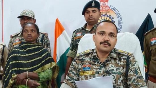 Woman Maoist, identified as Gita (left), after her surrender before Dhamtari police on Monday. (HT Photo)