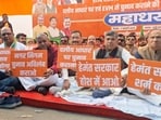 BJP leaders during a sit-in protest outside the Ranchi Municipal Corporation on Wednesday. (HT Photo)