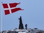 Danish flag flutters next to Hans Egede Statue in Nuuk, Greenland. (REUTERS) Danish flag flutters next to Hans Egede Statue in Nuuk, Greenland. (REUTERS)