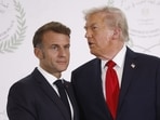 US President Donald Trump talks to French President Emmanuel Macron.
