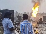 Smoke and flames billow out after a gas leak at an ONGC sparked an inferno, leading to the evacuation of around 600 people from three villages within a four-km radius, in Konaseema, Andhra Pradesh on Tuesday. (PTI)