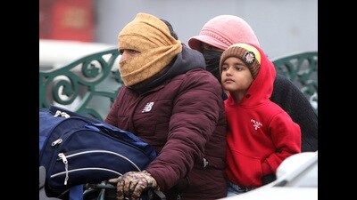 A family covered up for protection against the cold weather in Bathinda on Wednesday. (Sanjeev Kumar/HT) A family covered up for protection against the cold weather in Bathinda on Wednesday. (Sanjeev Kumar/HT)