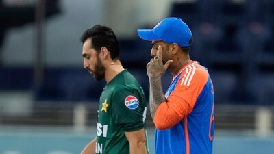 India's captain Suryakumar Yadav, right, and Pakistan's captain Salman Agha walk onto the field before the start of an Asia Cup cricket match. (AP) India's captain Suryakumar Yadav, right, and Pakistan's captain Salman Agha walk onto the field before the start of an Asia Cup cricket match. (AP)