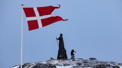 Danish flag flutters next to Hans Egede Statue in Nuuk, Greenland. (REUTERS) Danish flag flutters next to Hans Egede Statue in Nuuk, Greenland. (REUTERS)